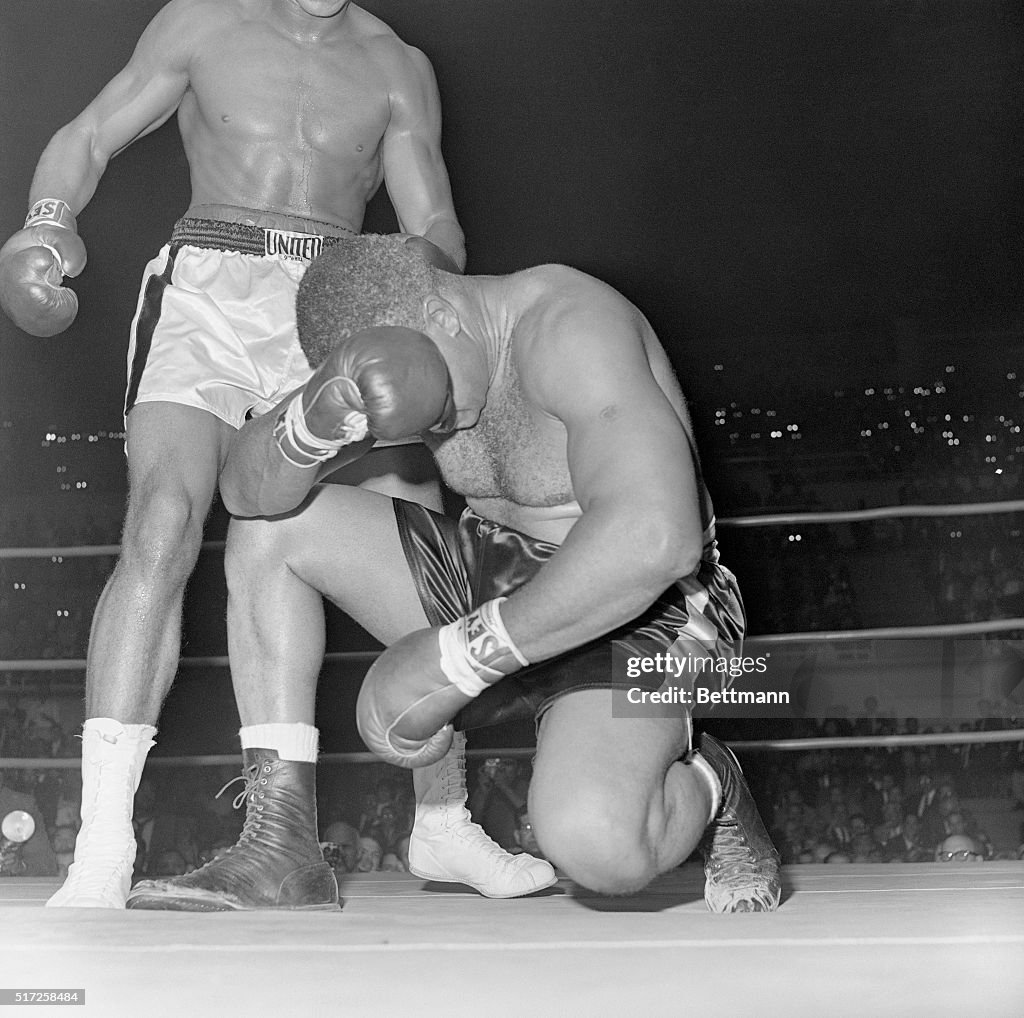 Boxer Cassius Clay Defeating Archie Moore