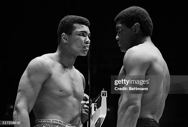 Cassius Clay and Ernie Terrell get nose to nose during weigh-in ceremonies prior to the world's heavyweight championship fight 2/6. Clay weighed in...