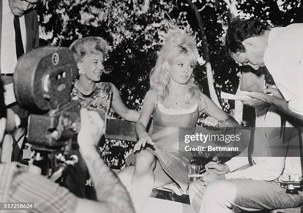 Bit of upper leg is revealed as French film queen Brigitte Bardot holds a press conference here recently. The popular cinema star called the news...