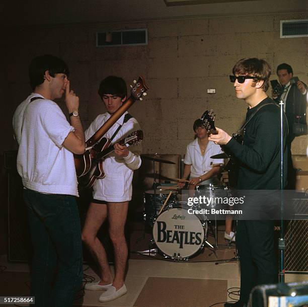 Miami Beach, Fla.: The Beatles, in their bathing suits, rehearse in the Deauville Hotel for their next appearance in the Sullivan TV show.