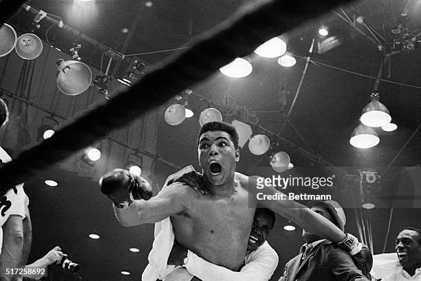 M the champ!" screams Cassius Clay as his handlers hug him joyfully after he defeated Sonny Liston for the heavyweight boxing title. Clay was...