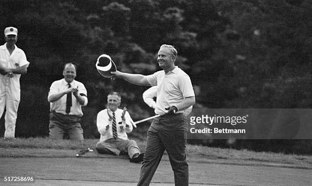 Baltrusol, N.J.: Jack Nicklaus waves his hat to the gallery and strides toward cup after sinking a 23-foot putt on the final hole of the U.S. Open...