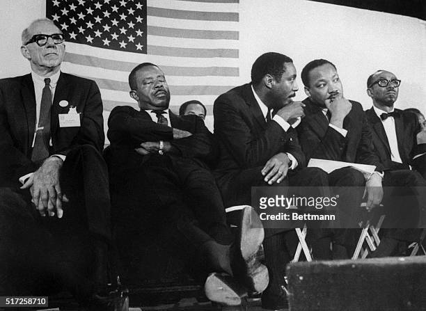 Chicago, Illinois: Four of the chief delegates to the National Conference for New Politics hear addresses by another delegate during session here....