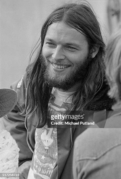 English guitarist David Gilmour, of Pink Floyd, at a free concert in Hyde Park, London, 31st August 1974. He is performing with Roy Harper, John Paul...