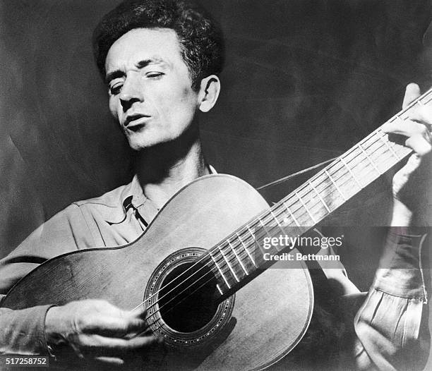 Woody Guthrie Playing the Guitar