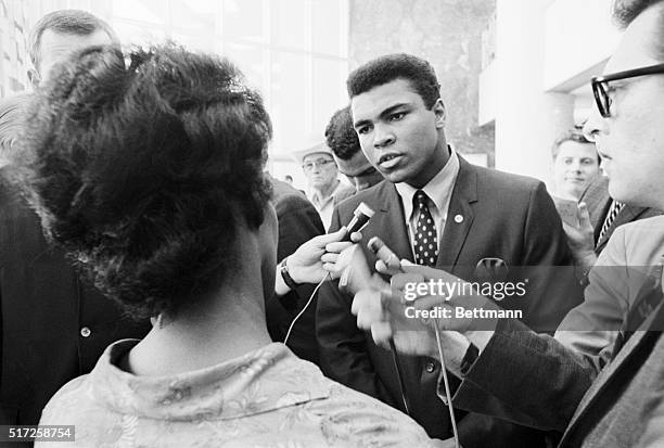 Boxer Muhammad Ali talking with the press after being indicted by a Federal Grand Jury for his refusal to be inducted into the armed forces. Ali...