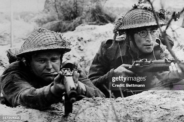 Beatle John Lennon and Roy Kinnear play members of a British Platoon caught up in World War II's north Africa campaign in United Artists' How I Won...