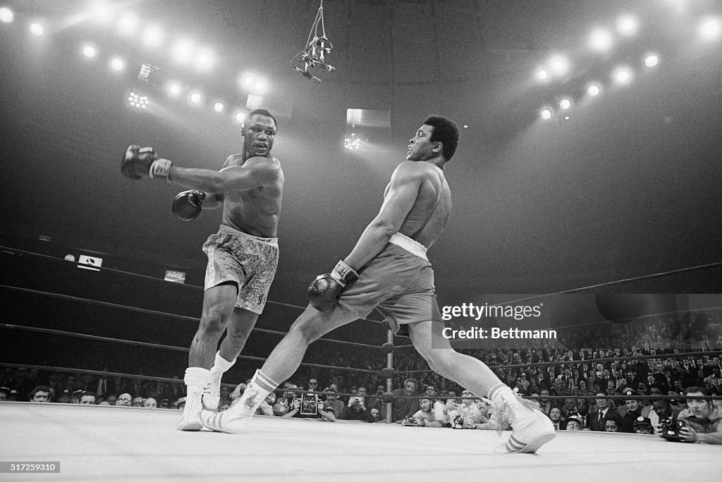 Boxer Ali Dodging a Punch From Frazier