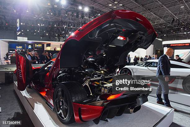 Christian von Koenigsegg, founder of Koenigsegg Automotive AB, speaks while standing next to the Regera luxury vehicle during the 2016 New York...