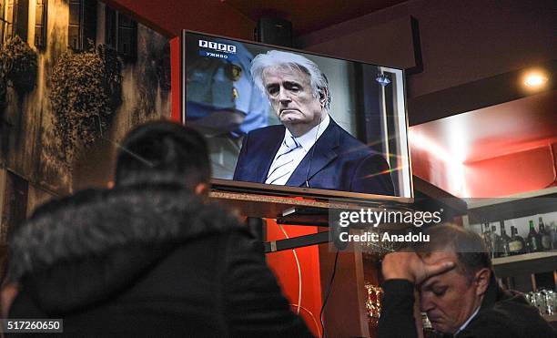 Bosnian Serbs, follow news on television in Sarajevo, Bosnia and Herzegovina after Radovan Karadzic trial held at the International Criminal Tribunal...