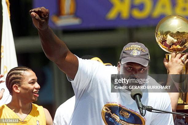 Los Angeles Lakers' MVP player Shaquille O'Neal salutes the crowd before riding a bus in a welcoming parade to celebrate the Lakers' NBA title in Los...
