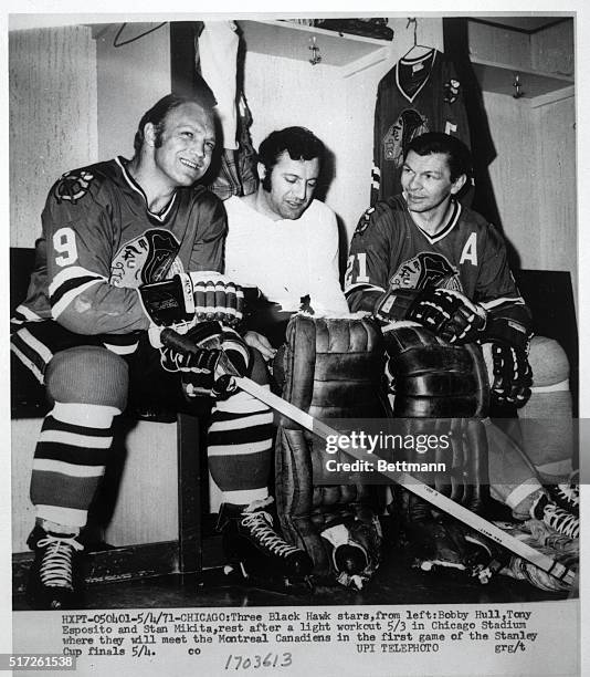 Three Black Hawks stars, from left: Bobby Hull, Tony Esposito and Stan Mikita, rest after a light workout 5/3 in Chicago Stadium where they will meet...