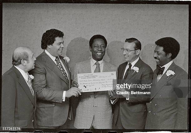 Atlanta Brave's superstar Henry "Hank" Aaron, accepts a $10,150.00 check from the City of Atlanta and the Atlanta Chamber of Commerce here on...