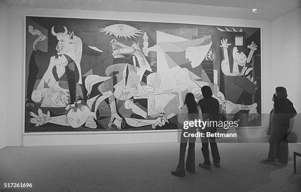 Picasso's Guernica. New York: Spectators view haunting mural titled, Guernica, executed in 1937 by Spanish-born painter Pablo Picasso, at Museum of...