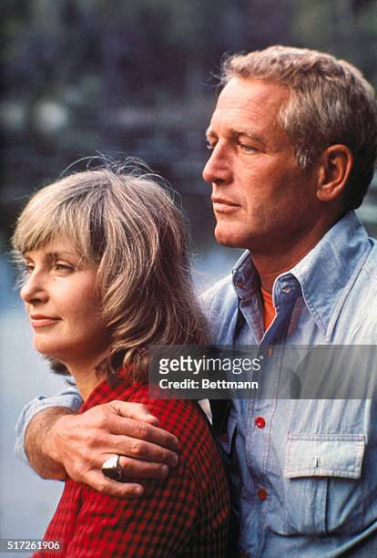 Actor Paul Newman and his wife, actress Joanne Woodward shown on location for a television special. Slide shows full length view of the two.
