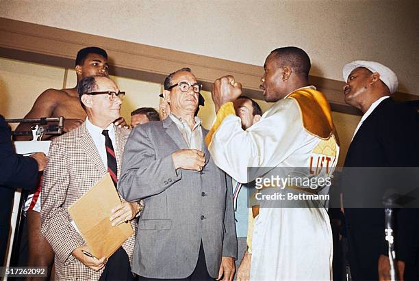Cassius Clay was yelling at heavyweight champion Sonny Liston during weigh-in here for their title fight. Clay was fined $2,500 for his "conduct on...