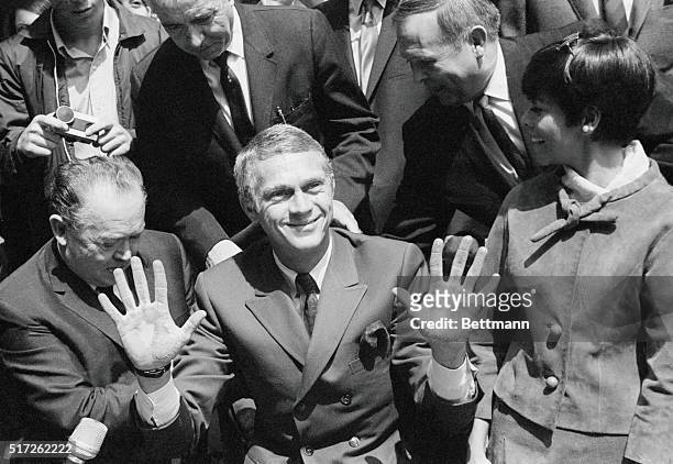 Actor Steve McQueen, with his wife Nelle at his side, , joined the select group of screen stars, by adding his name and footprints to the forecourt...