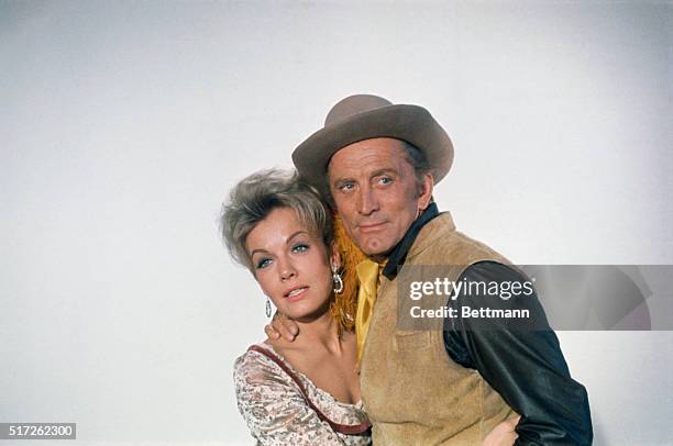 Joanna Barnes and Kirk Douglas in costume for the motion picture The War Wagon.