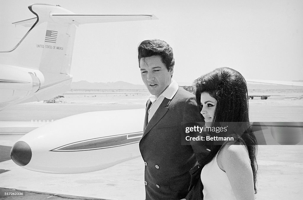 Elvis and Priscilla Presley at Airplane Door