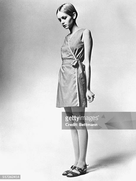 Model Twiggy is shown as she modeled a design from her own summer collection- a cotton voile and daisy trimmed dress.
