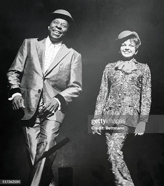 Manhattan, New York, New York: John Bubbles dances a soft shoe with Judy Garland during her current show at the grand old house, more than 45 years...