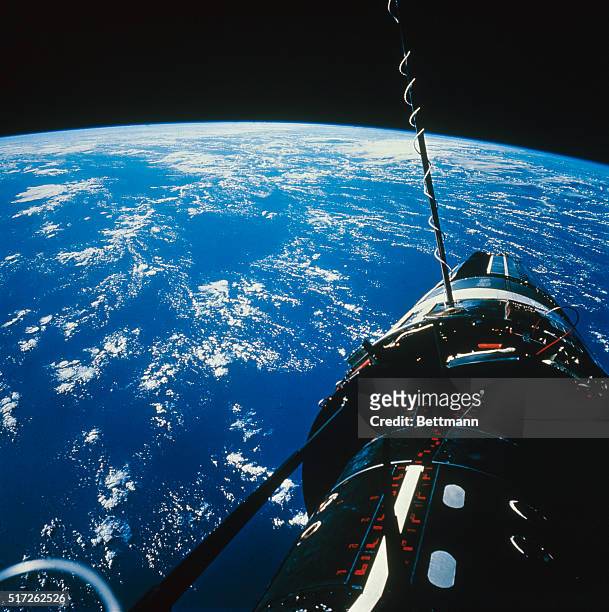 Excellent view of the docked Apollo 9 Command/ service Module and Lunar "Spider" with Earth in background, during astronaut David R. Scott's extra...