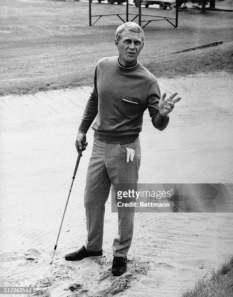 Multimillionaire Thomas Crown, played by Steve McQueen, bets his opponent double or nothing that he can make a hole in one from this sand trap in...