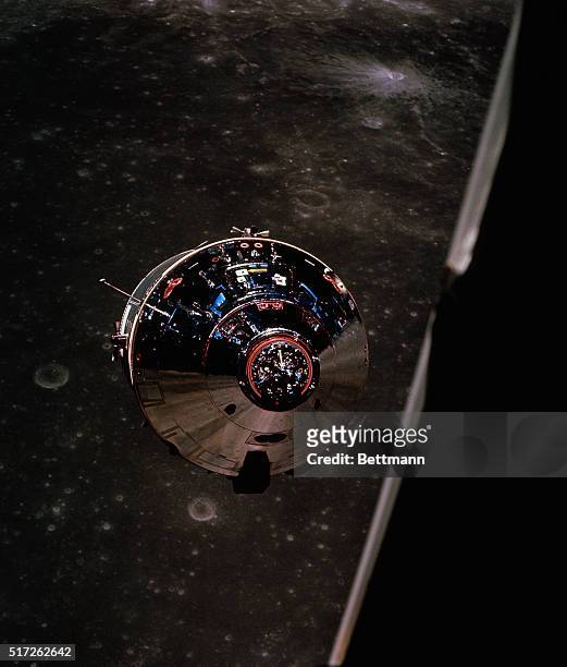 Views of the command module taken from the lunar module after separation during Apollo-10 flight May 22nd. Moon's surface appears in background.