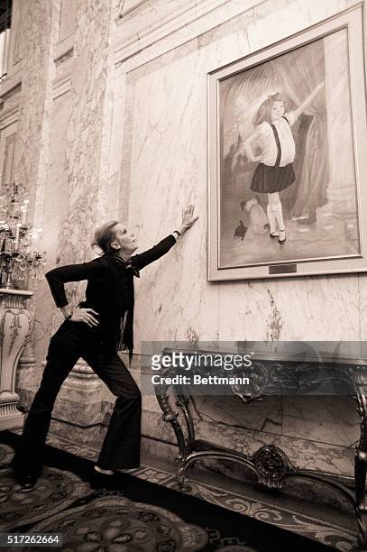 New York, NY- Long-legged, pant-suited and very sleek, Kay Thompson mimics her brainchild "Eloise," whose portrait is back again in the lobby of New...