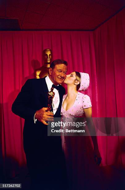 John Wayne received the "Best Actor of 1969" Oscar for his role in "True Grit." Presenting the award at the 42nd annual presentation of the Academy...
