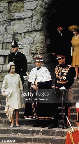 Newly crowned Prince of Wales, Great Britain's Prince Charles, stands with his mother, Queen Elizabeth II ; sister, Princess Anne; father, Prince...