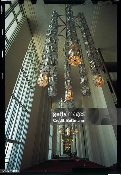 Modern crystal and metal chandeliers, a gift from Sweden, add to the glittering look of the foyer of the John F. Kennedy Center for the Performing...