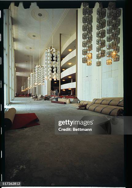 Modern crystal and metal chandeliers, a gift from Sweden, add to the glittering look of the foyer of the John F. Kennedy Center for the Performing...
