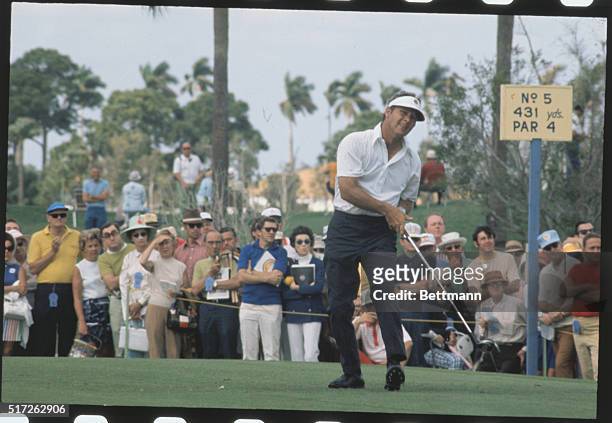 Palm Beach Gardens, Florida: Golfer Arnold Palmer plays during fifth hold action of PGA Championship. With him in some frames is Dave Hall .