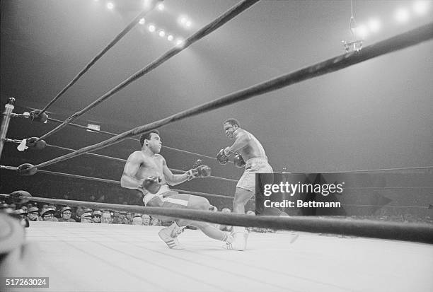 Boxer Joe Frazier knocking out Mohammad Ali during the heavyweight title match in 1971. Frazier won the match and became the heavyweight champion.