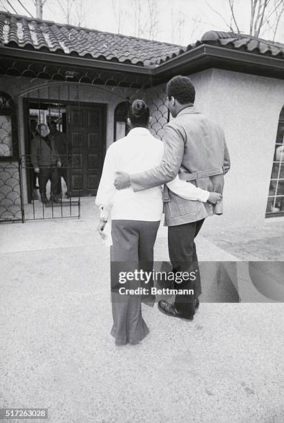 Cherry Hill, New Jersey: Cassius Clay walks arm in arm with his wife, Belinda at their new home in Cherry Hill, New Jersey, 3/11. Clay was quiet and...