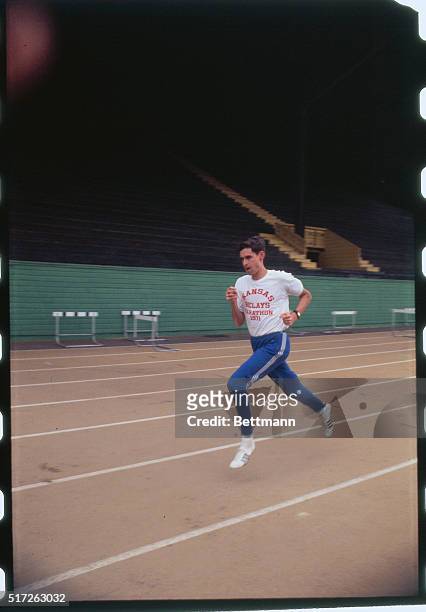 Eugene, Oregon: Various views of Jim Ryun working out/running at Stephensen Track at U. Of Oregon on a later April afternoon.
