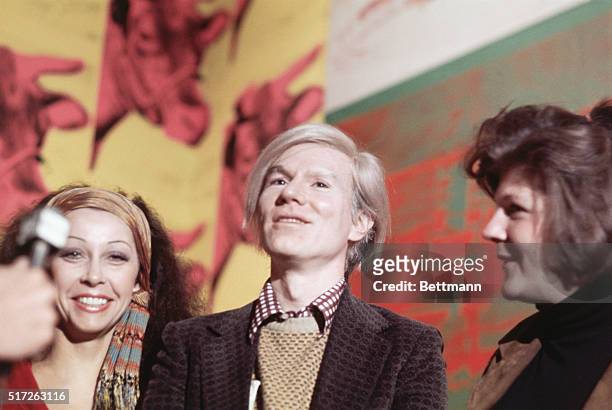 Ultra Violet, Andy Warhol, and Brigid Polk being interviewed at a press conference on April 29, 1971. Andy is being interviewed in the Whitney Museum...