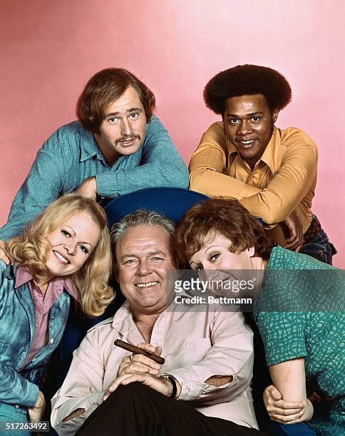 All in the Family cast: Carroll O'Connor , Sally Struthers , Rob Reiner , Mike Evans and Jean Stapleton.