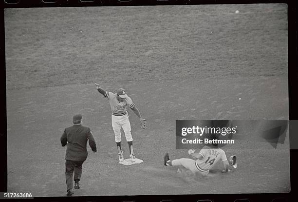 Cincinnati Reds' outfielder Pete Rose steals second, and then continued to third when Athletics' catcher Gene Tenace's throw sailed into center...