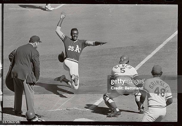 George Hendrick of the Oakland Athletics is safe at home in second inning on Jim hunter's single October 15, during second game of 1972 World Series...