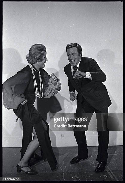 Gene Kelly and Binnie Barnes are up to their old steps as they go through a dance routine before filming Columbia Pictures "40 Carats." Kelly is...