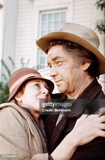 Actress Michael Learned embraces actor Ralph Waite in scene from the TV series The Waltons.