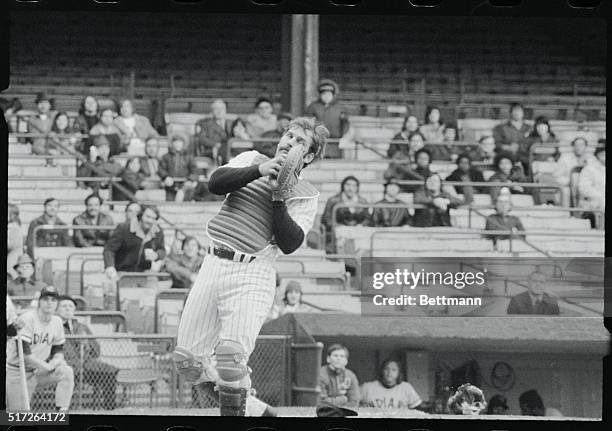 New York Yankees' catcher Thurman Munson is shown wearing his catching equipment as he catches a pop fly.