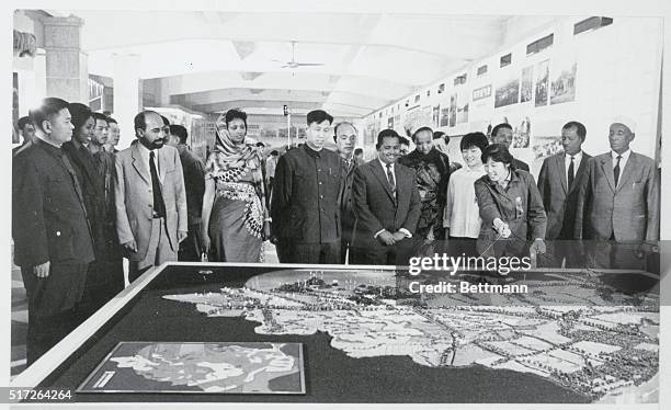 Somali Trade Delegation at Fair. Kwangchow, China: The Somali Trade Delegation viewing a model featuring the rapid agricultural development of...