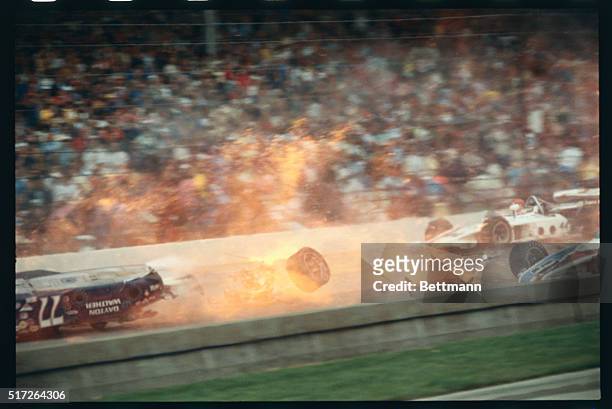 Indianapolis: Salt Walther, Dayton, Ohio, slides upside down in car 77 after hitting wall just after start of Indy 500.
