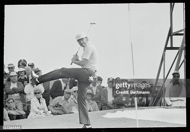 Augusta Ga.: First round leader Tommy Aaron kicks up his foot on the seventh green after saving his par for the hole. Aaron is tied with Bob...