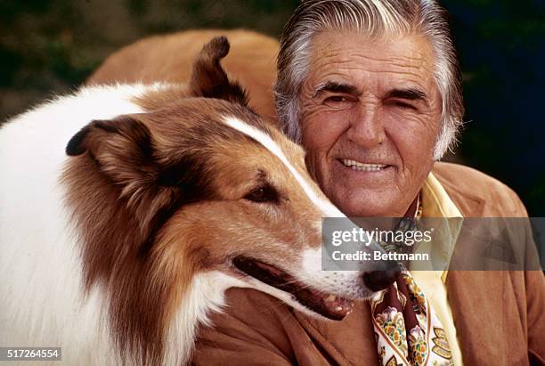 Lassie posed with owner and trainer, Rudd Weatherwax.