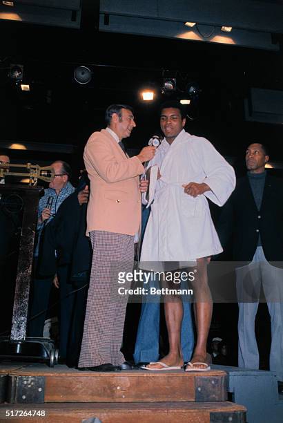 Sportscaster Howard Cosell interviews Muhammad Ali at weigh-in for non-title bout vs. Joe Frazier scheduled for January 28th at Madison Square...