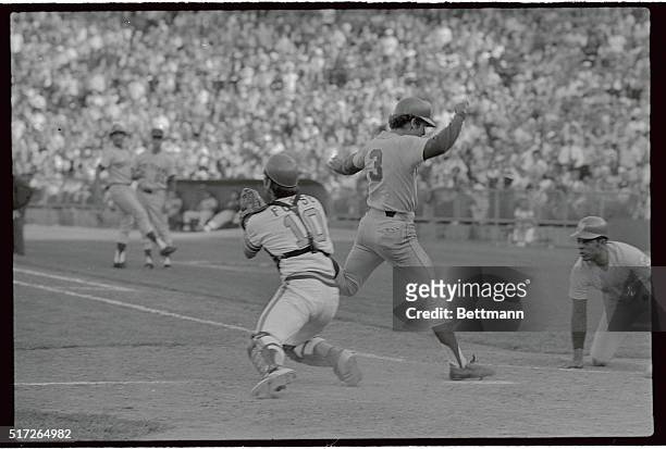 This play involved New York Met's Bud Harrelson as he crossed home plate in close play as Oakland A's catcher Ray Fosse tries for the out, and Mets...